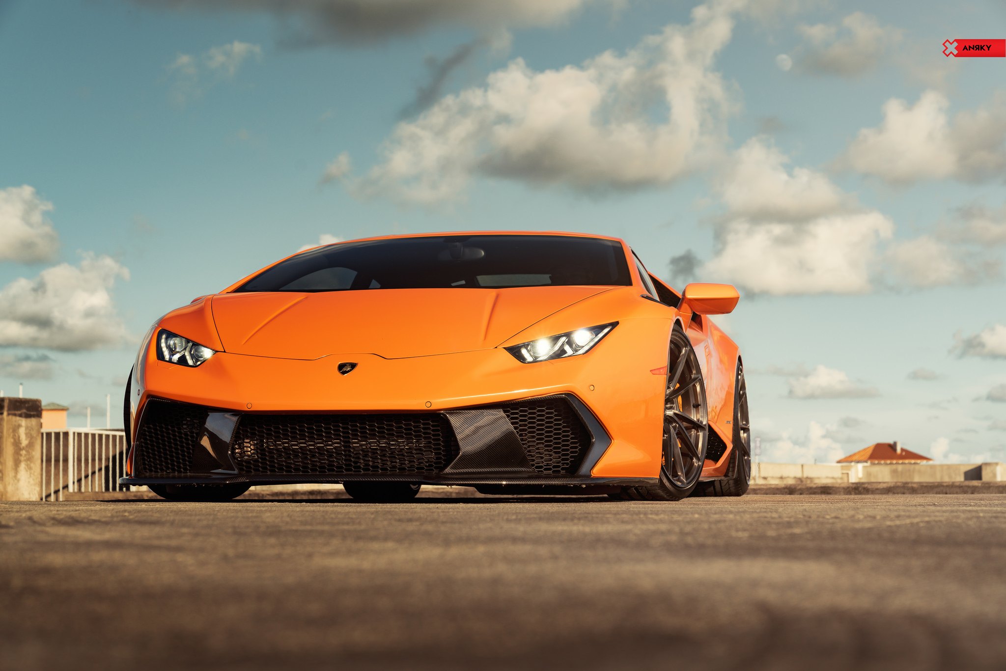 Carbon Fiber Front Bumper on Orange Lamborghini Huracan - Photo by ANRKY Wheels