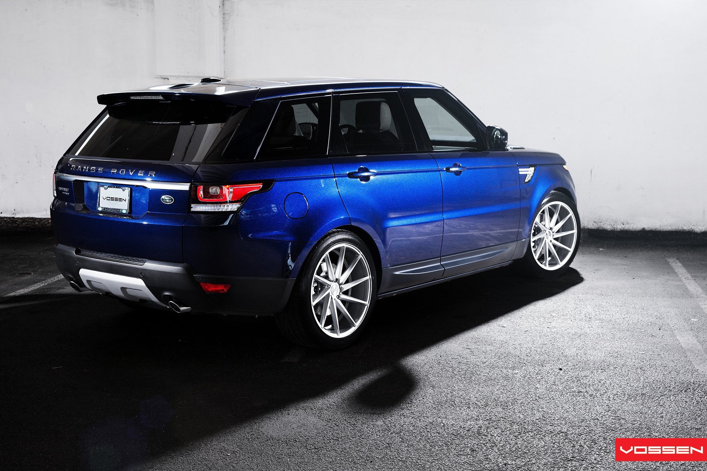 Blue Land Rover Sport with Aftermarket Rear Bumper Cover - Photo by Vossen