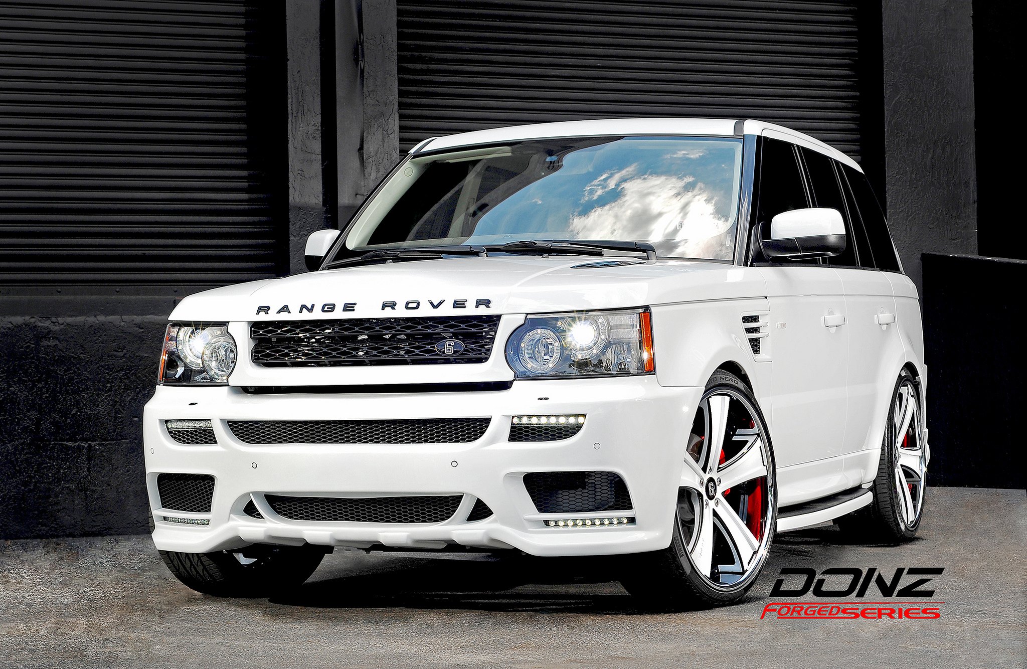 Front Bumper with Fog Lights on White Range Rover Sport - Photo by Rennen International