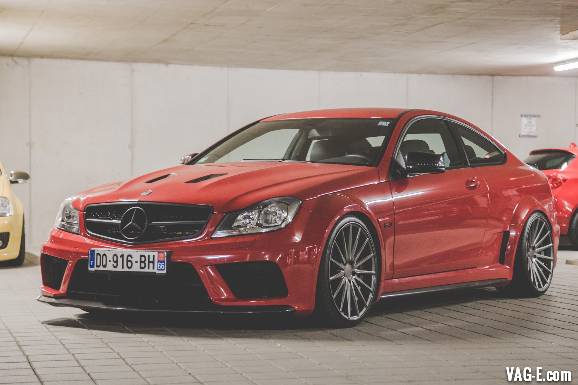 Red Mercedes C Class 6.3 with Custom Headlights - Photo by Vossen