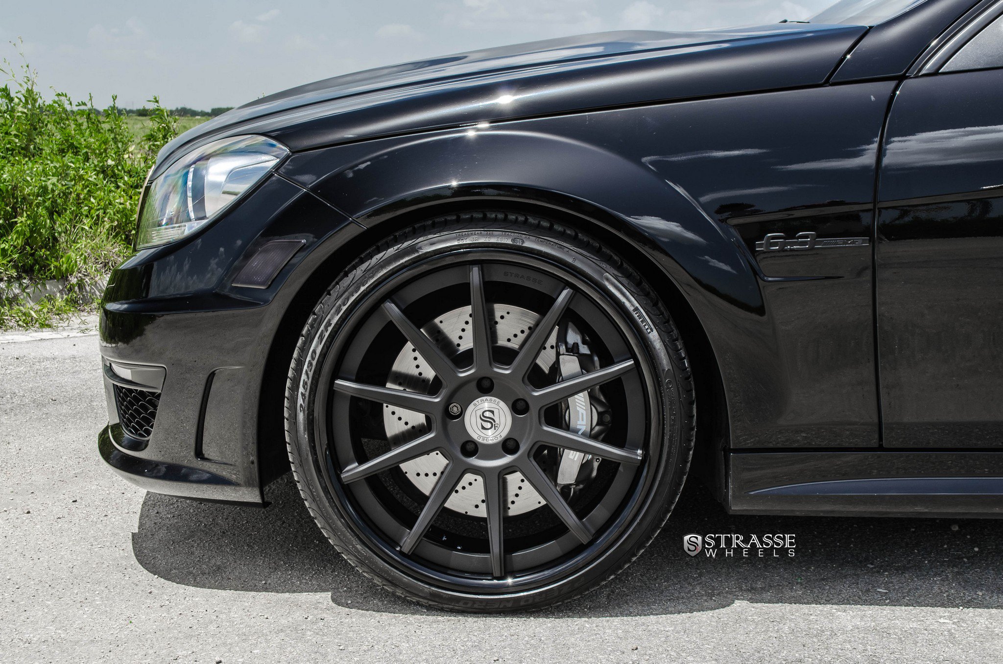 Black Mercedes C-Class 6.3 with Custom Side Skirts - Photo by Strasse Forged