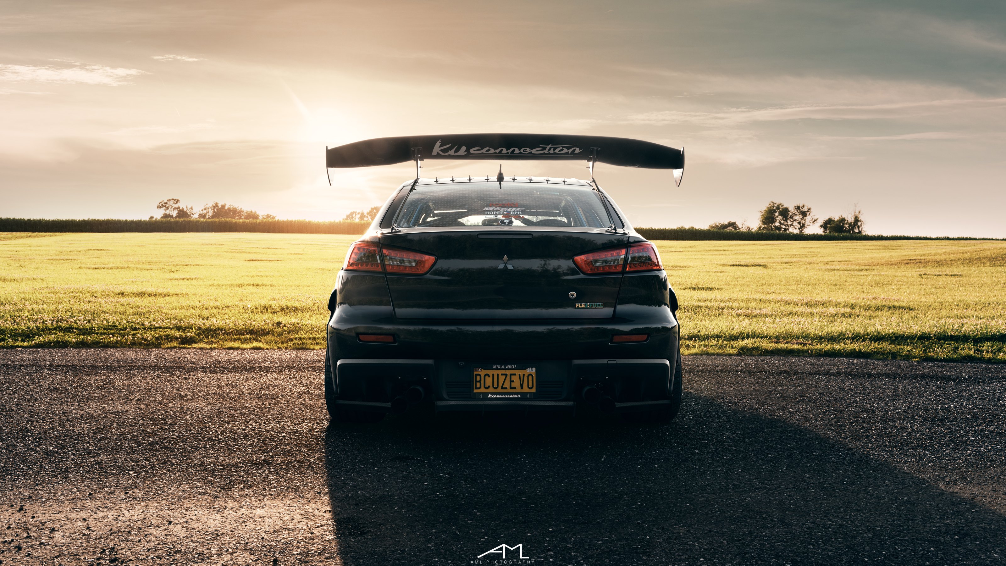 Black Mitsubishi Evolution with Large Wing Spoiler - Photo by Arlen Liverman