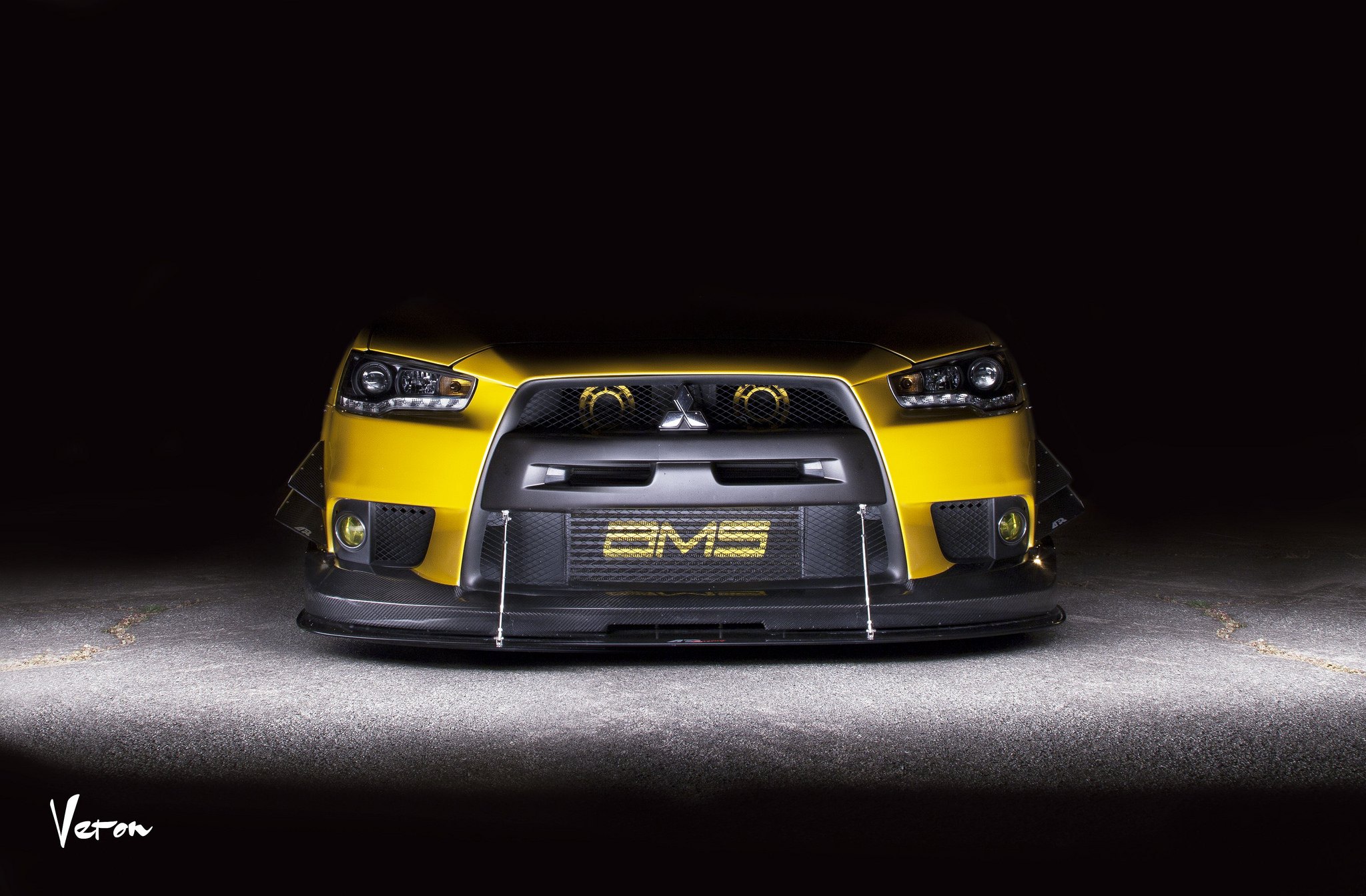 Aftermarket LED Headlights on Yellow Mitsubishi Evolution - Photo by Manuel Veron