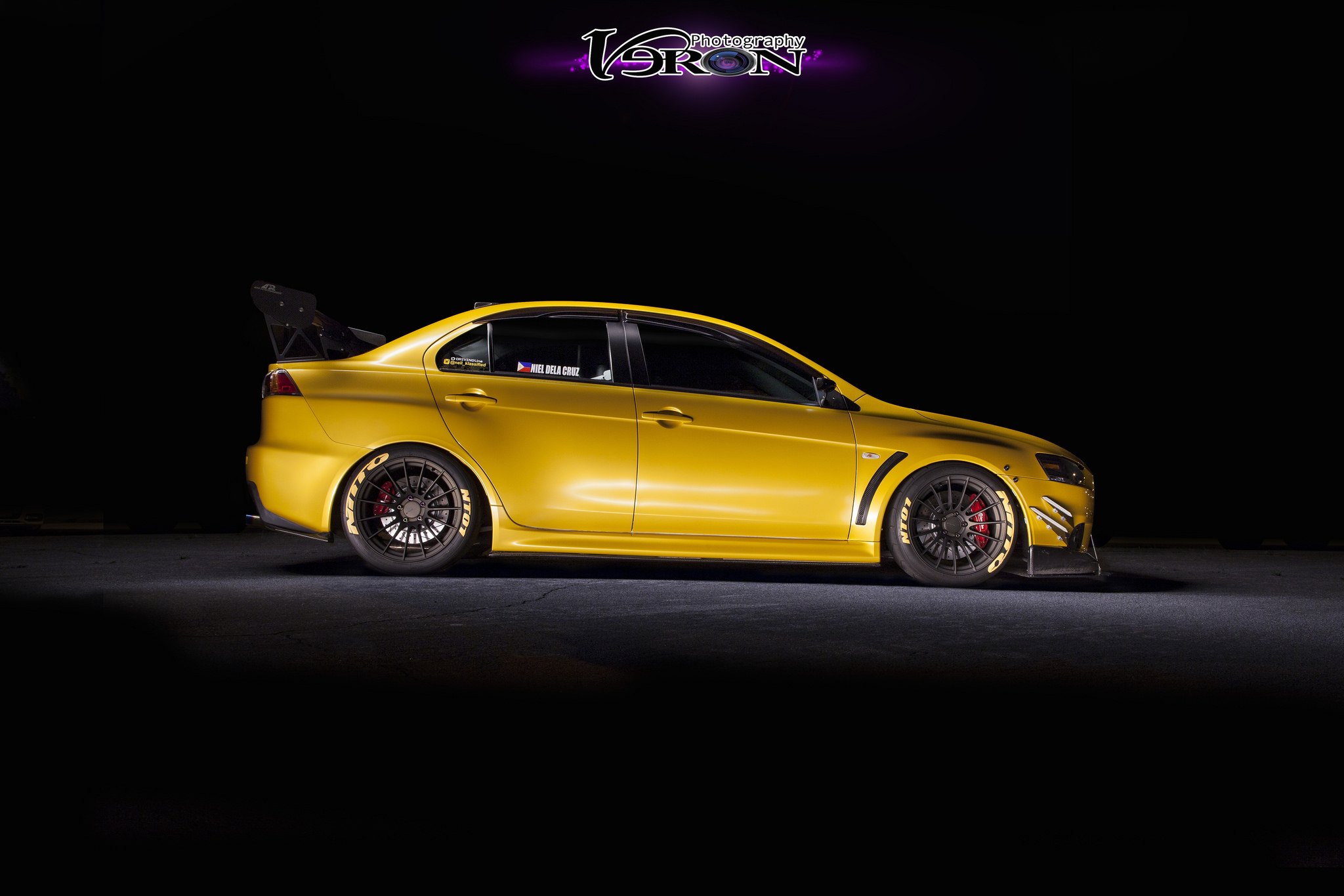 Nitto Tires on Custom Yellow Mitsubishi Evolution - Photo by Manuel Veron