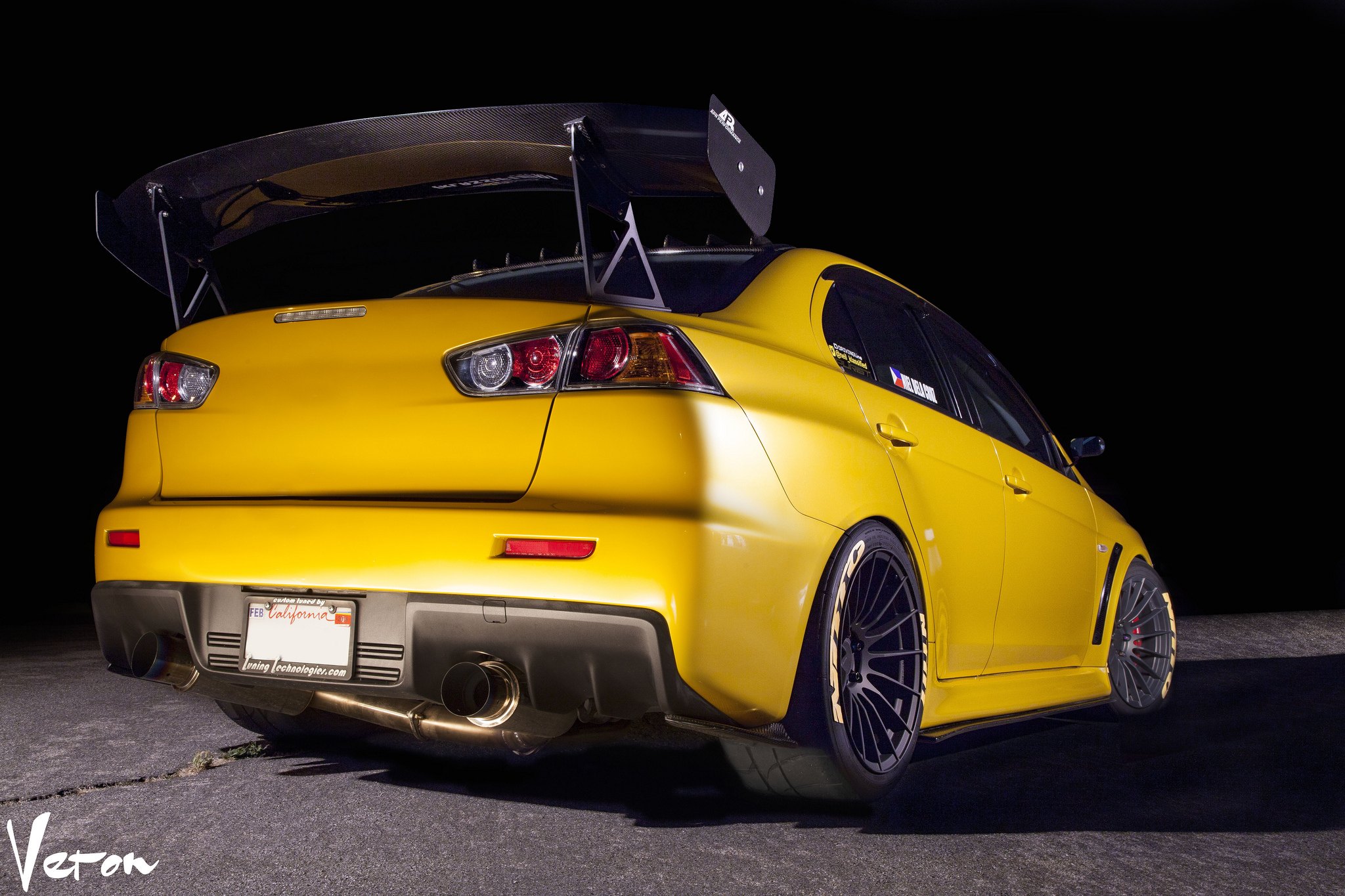 Yellow Mitsubishi Evolution with Large Wing Spoiler - Photo by Manuel Veron