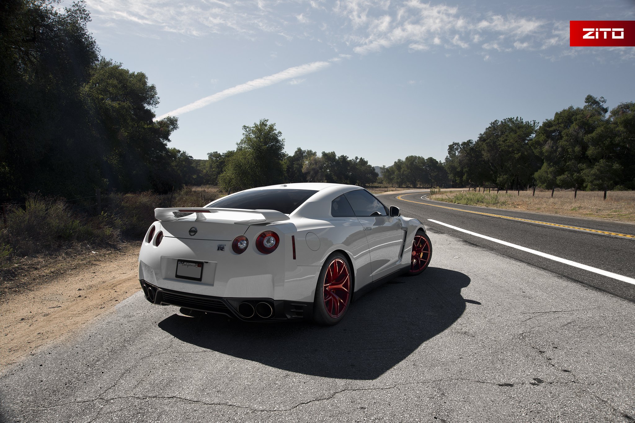 White Nissan GT-R with Aftermarket Rear Spoiler - Photo by Zito Wheels