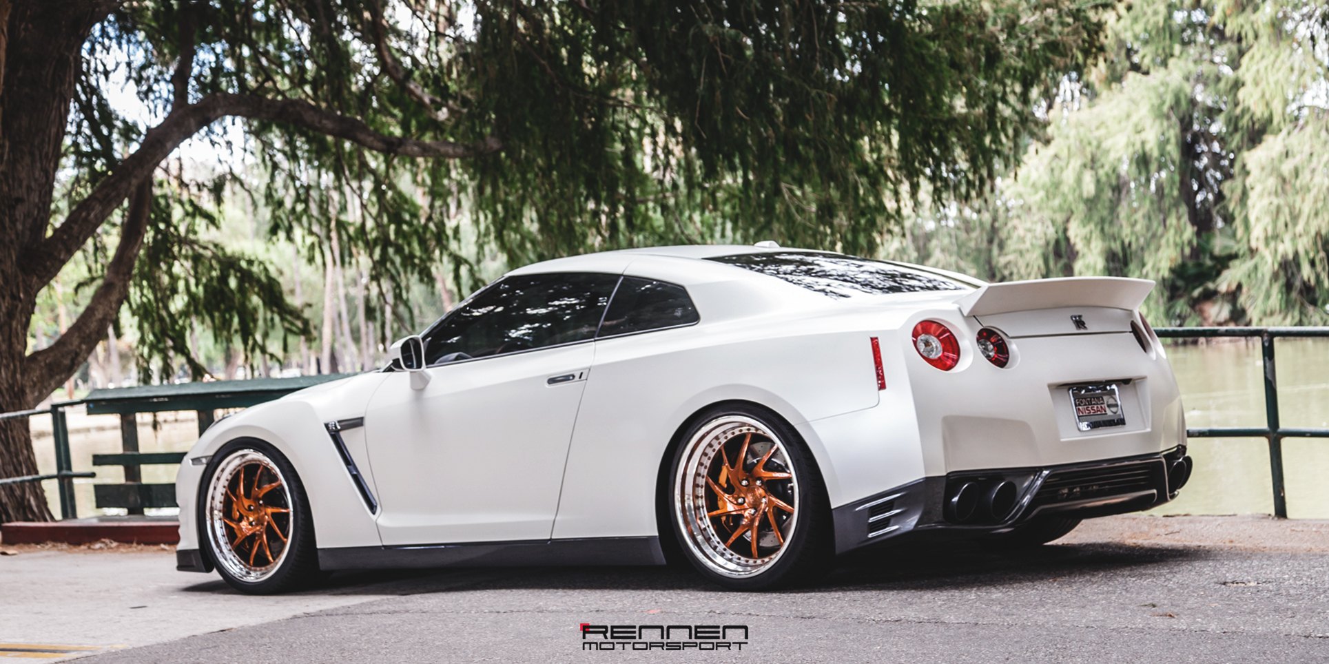 White Nissan GT-R with Custom Style Rear Spoiler - Photo by Rennen International