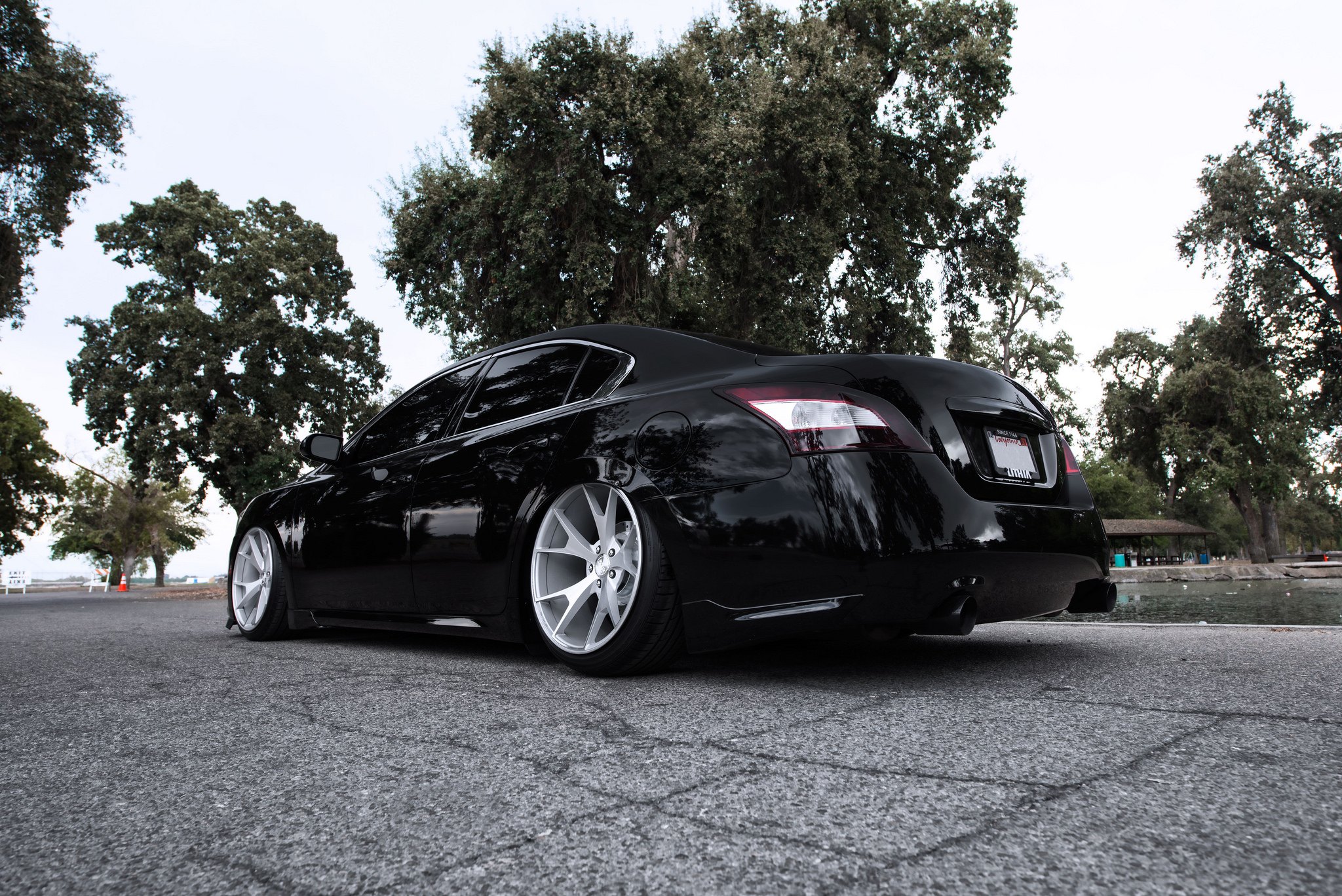 Aftermarket Side Skirts on Black Nissan Maxima - Photo by Concept One