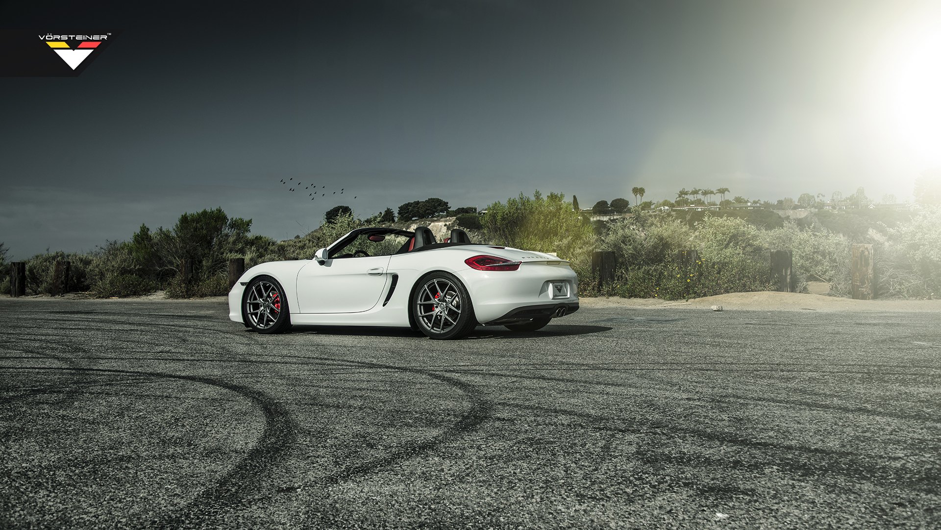 White Convertible Porsche Boxster with Custom Side Skirts - Photo by Vorstiner