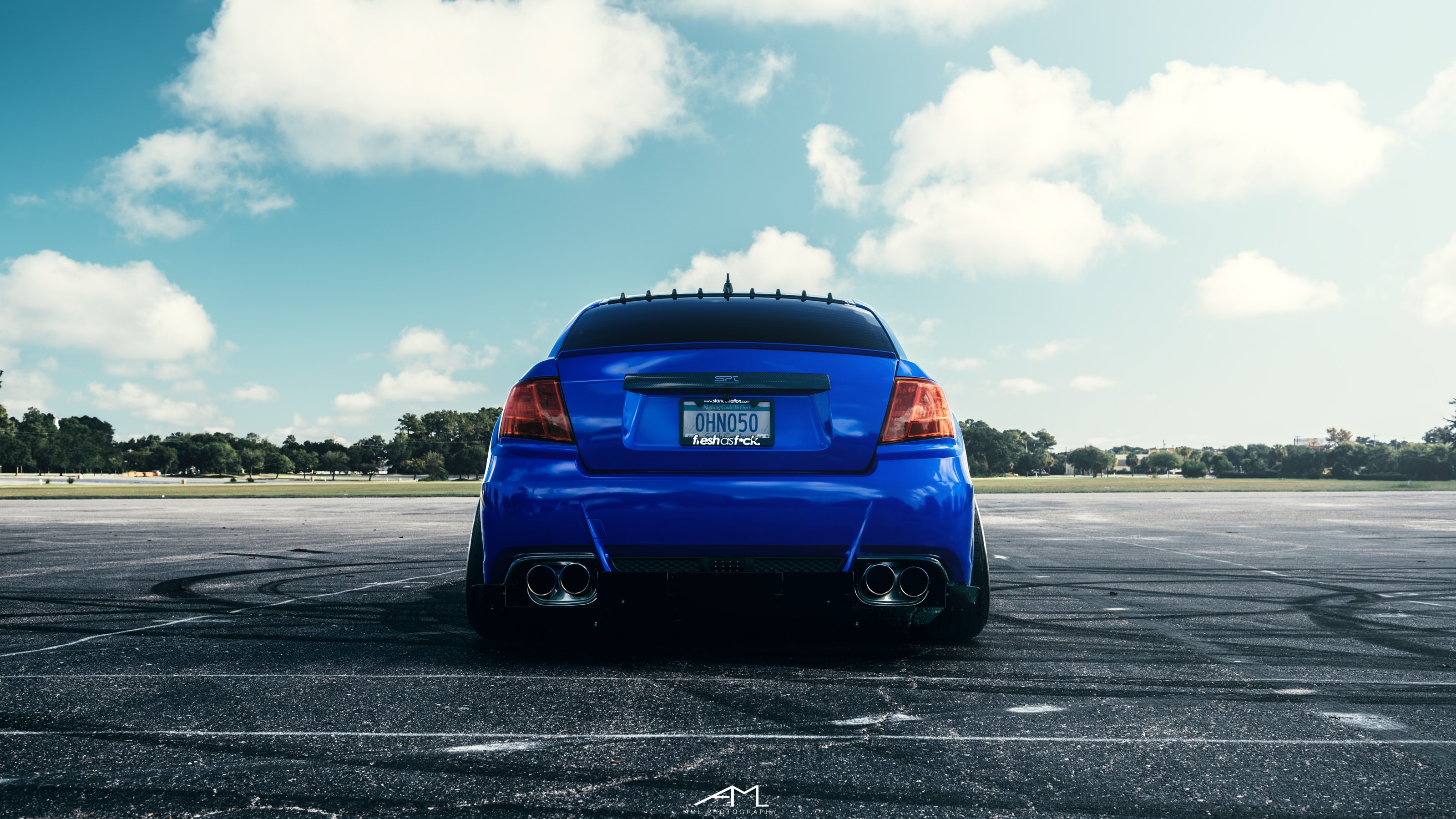 Blue Subaru WRX with Aftermarket Exhaust System - Photo by Arlen Liverman