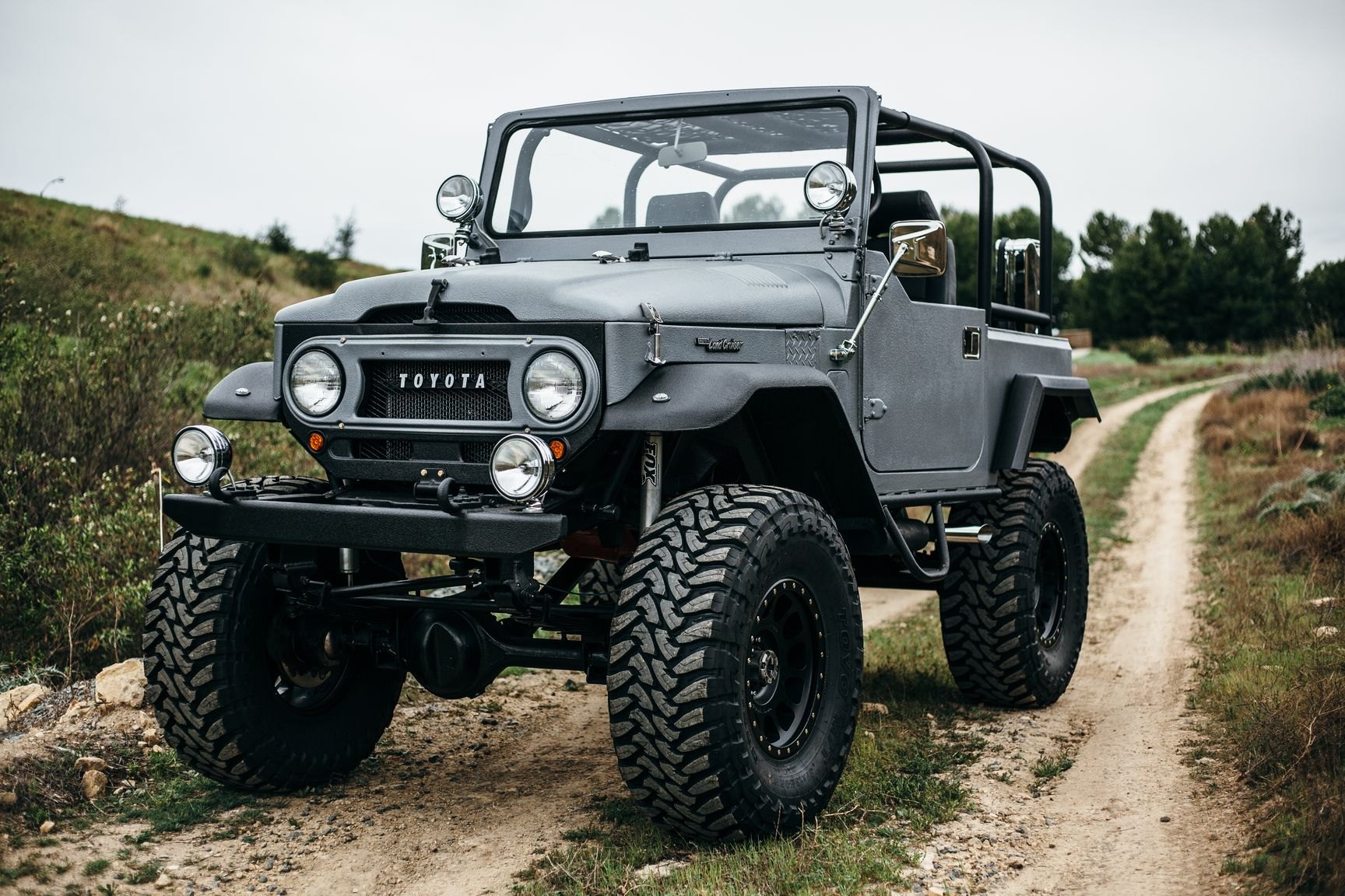 Gray Lifted Toyota Land Cruiser with Custom Front Bumper - Photo by Rebel Off-Road