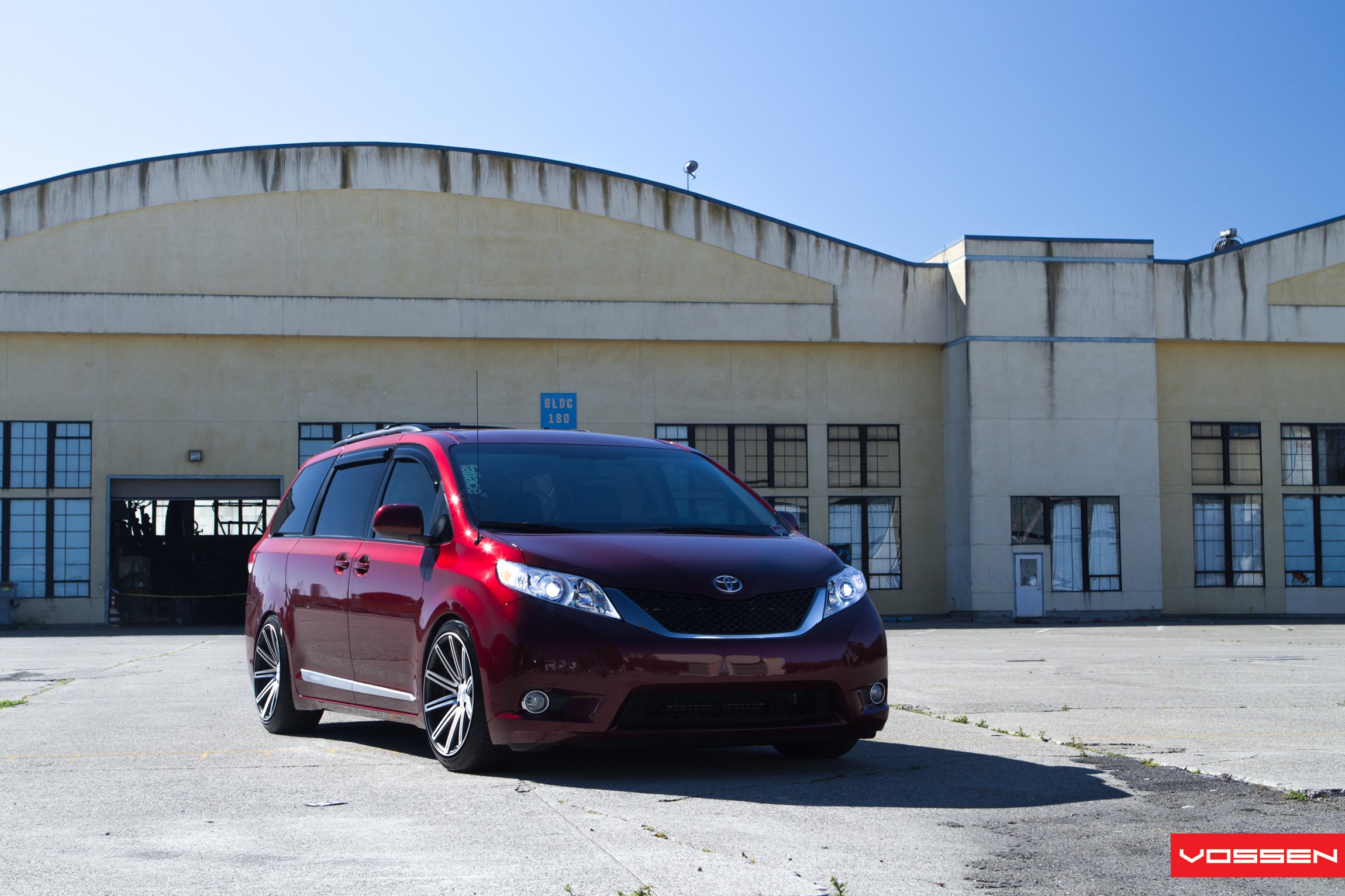 Red Toyota Sienna with Aftermarket Front Bumper - Photo by Vossen