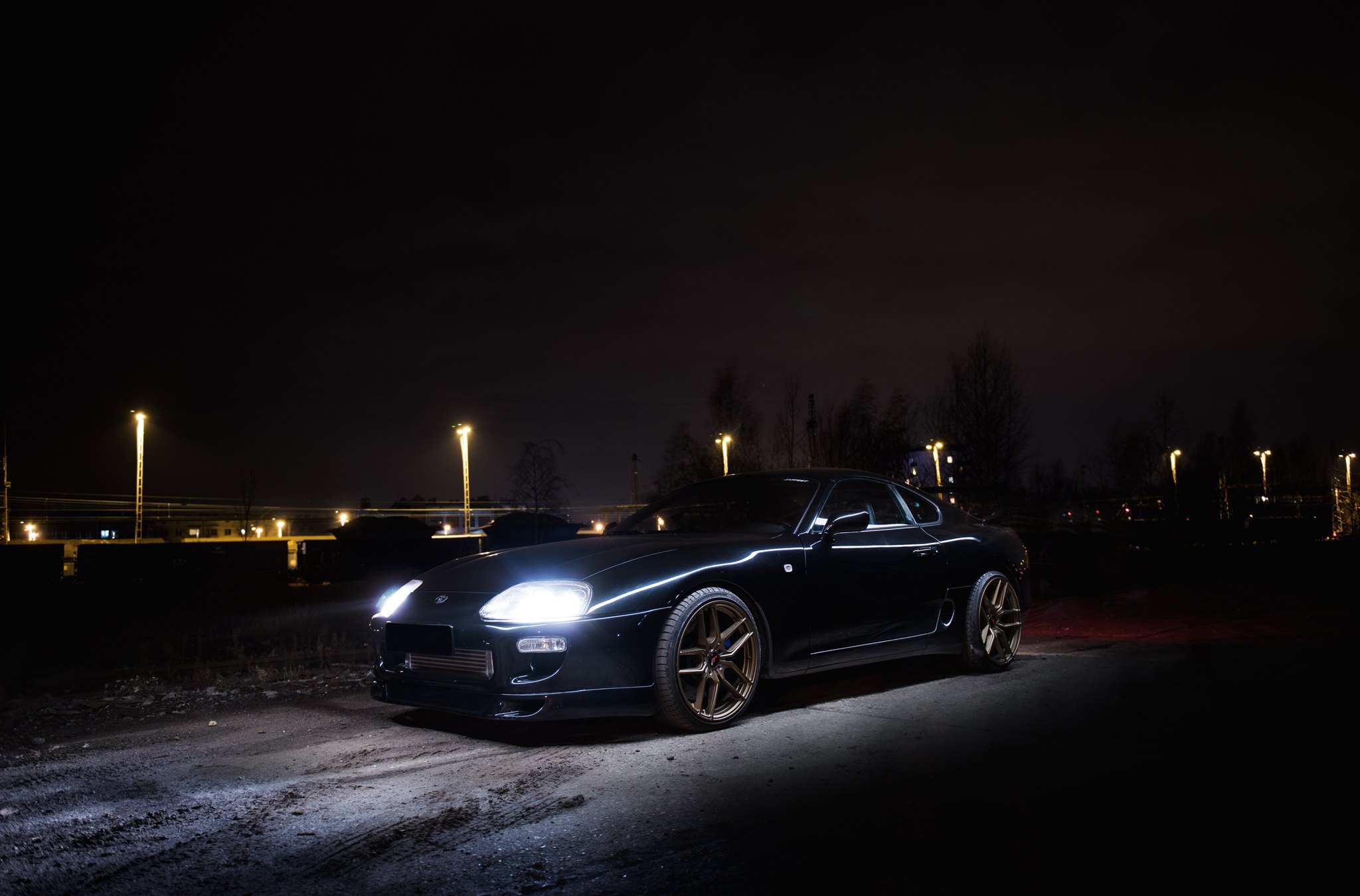 Black Toyota Supra with Aftermarket Crystal Clear Headlights - Photo by JR Wheels
