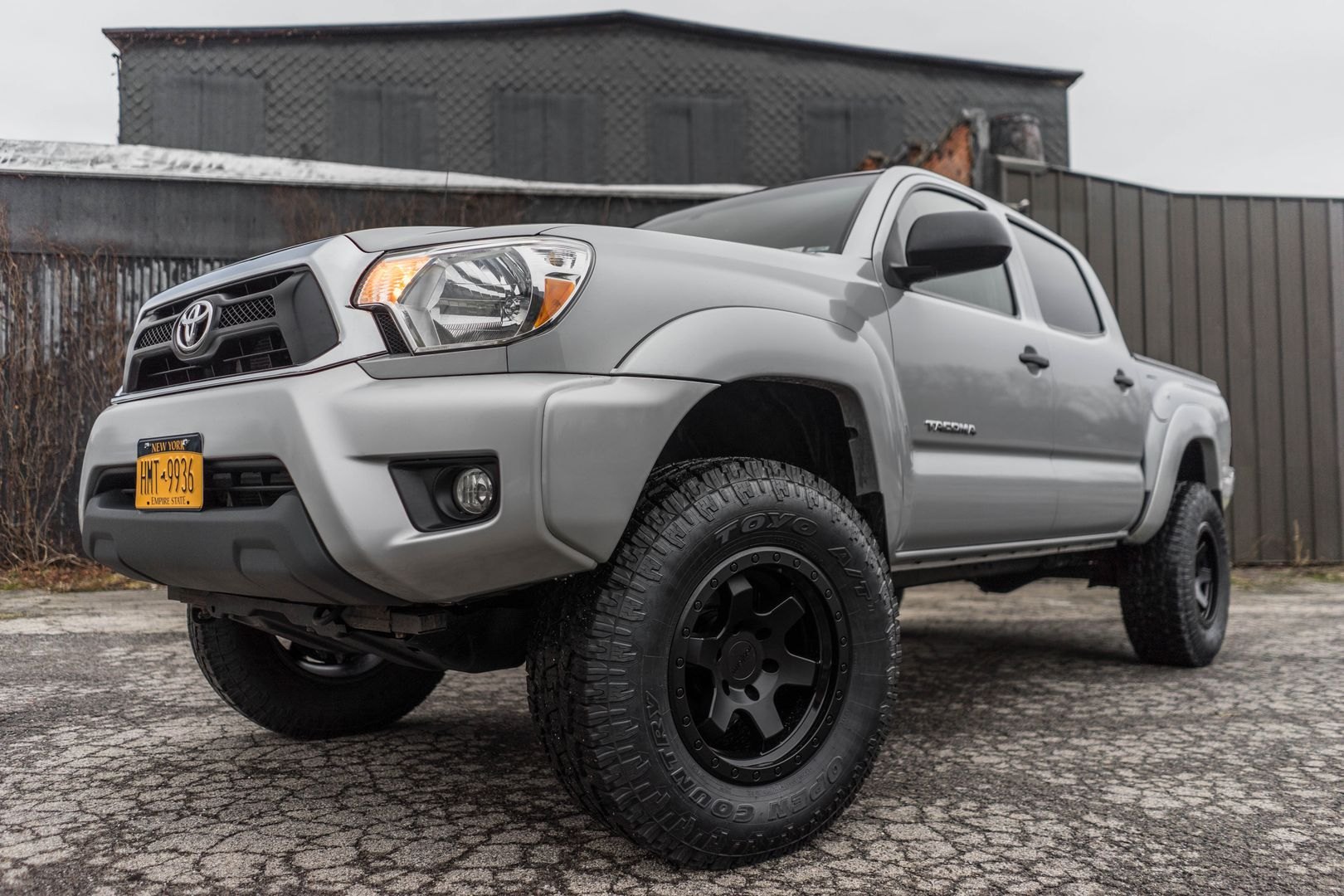 Gray Lifted Toyota Tacoma with Custom Bumper Guard - Photo by Rotiform