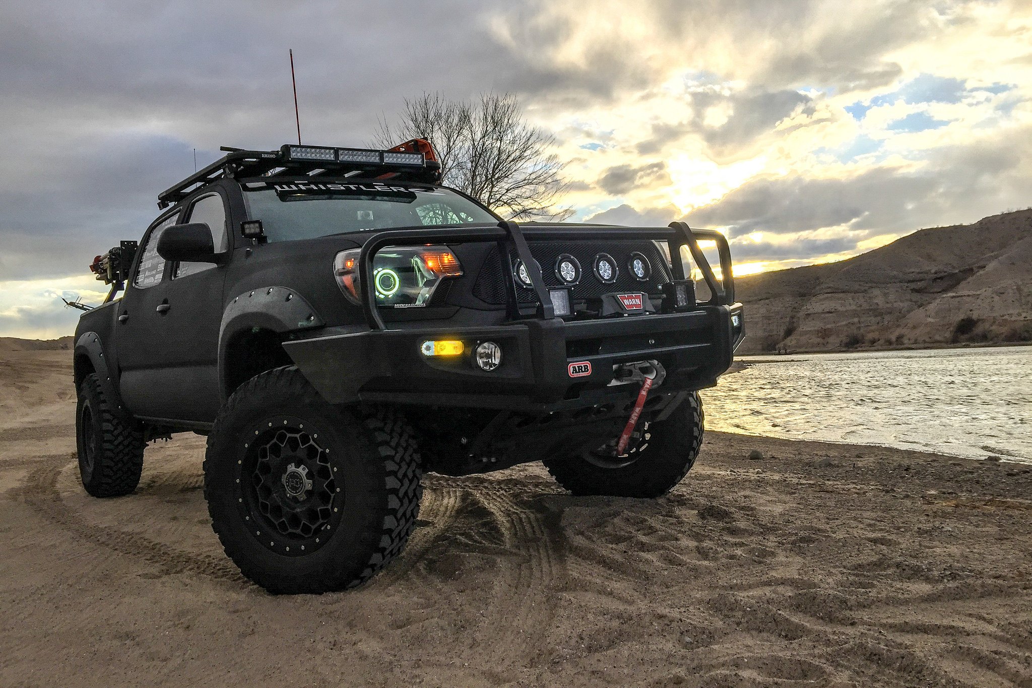 Black Lifted Toyota Tacoma with ARB Front Winch Bumper - Photo by TSW Alloy Wheels