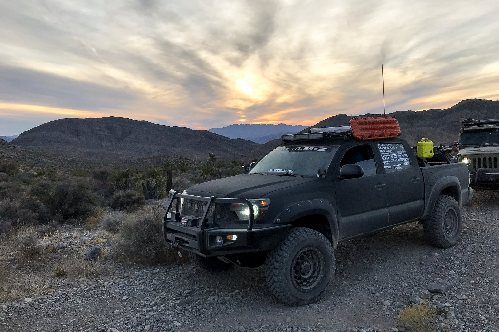 Black Lifted Toyota Tacoma with Roof Cargo Basket - Photo by TSW Alloy Wheels