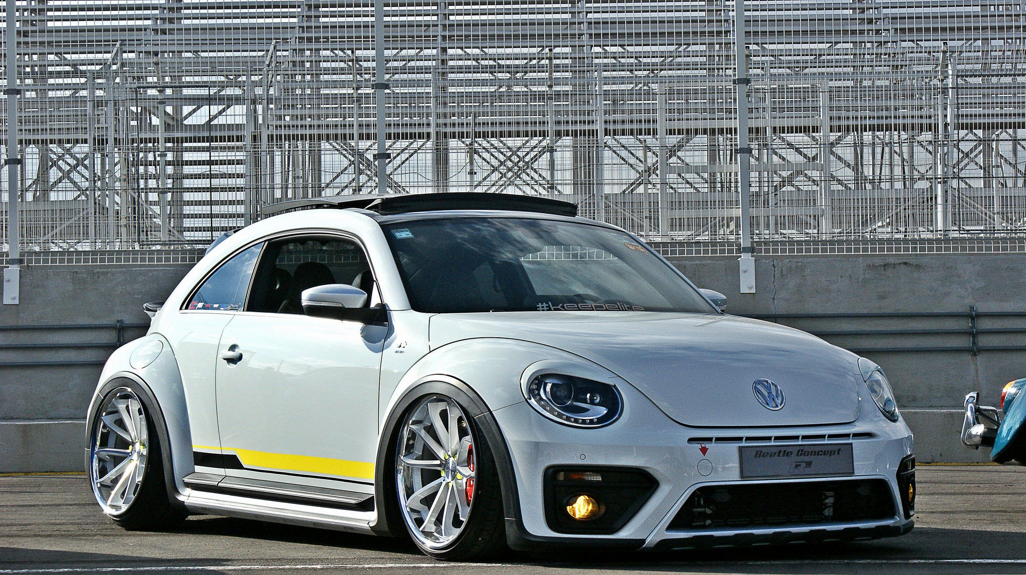 Customized to Impress: White Volkswagen Beetle Dressed in Aftermarket ...