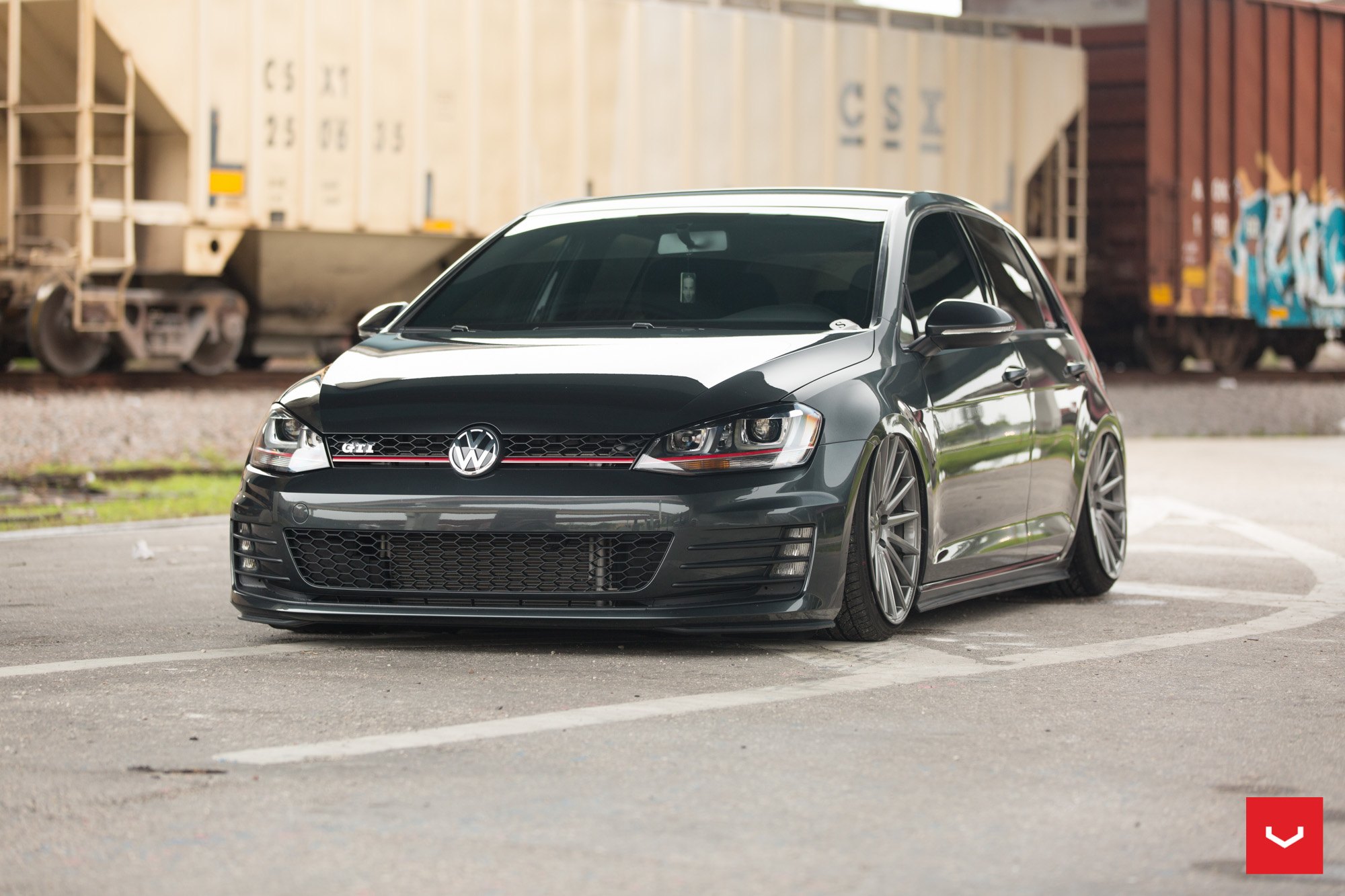 Stanced Black VW Golf GTI with Custom Front Bumper - Photo by Vossen