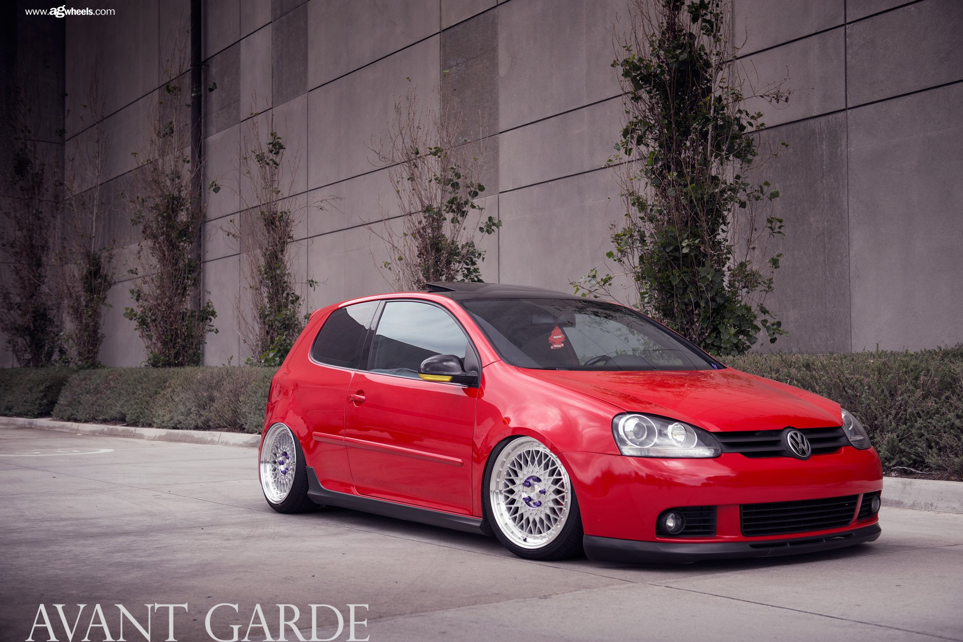 Red VW Golf with Aftermarket Headlights - Photo by Avant Garde Wheels