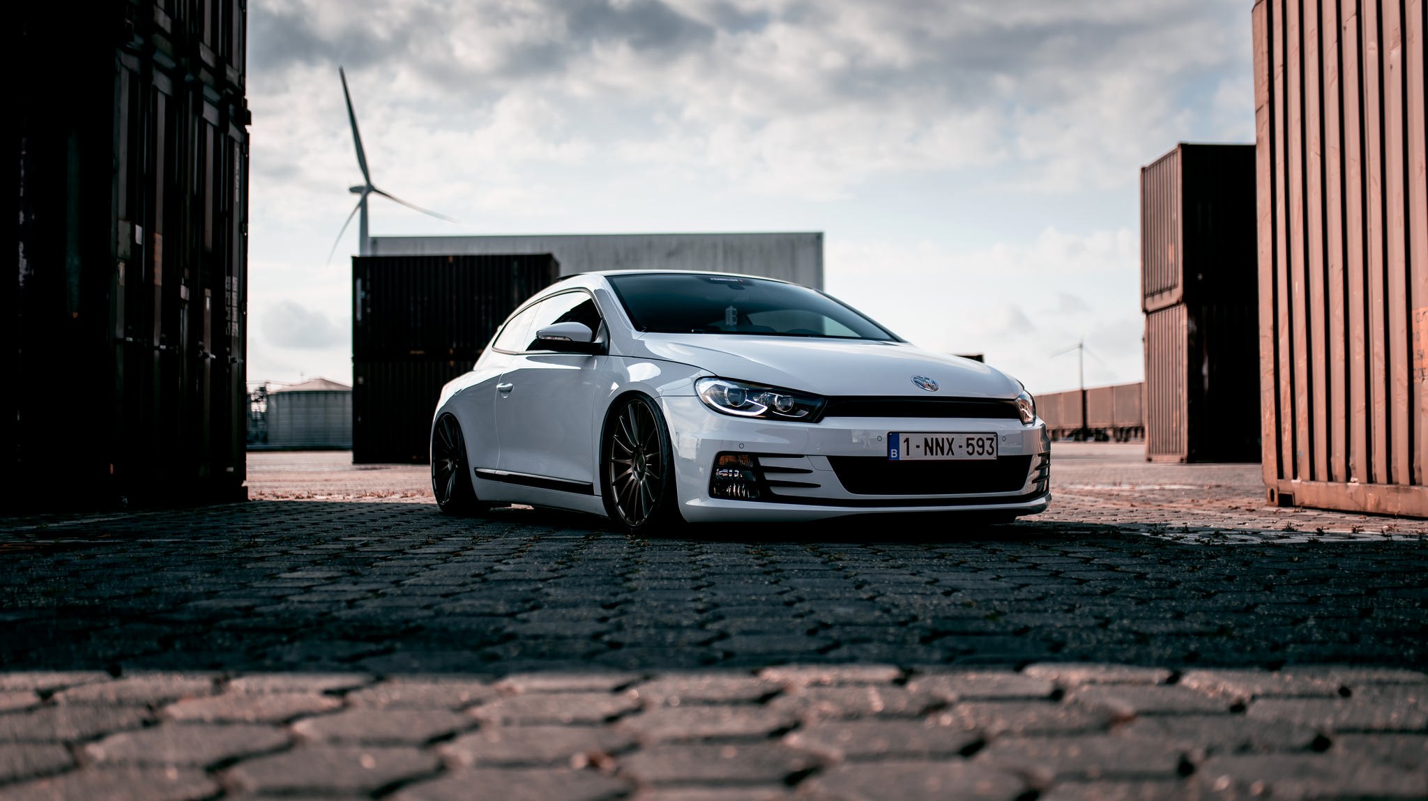 White VW Scirocco with Aftermarket Headlights - Photo by Niche Road Wheels