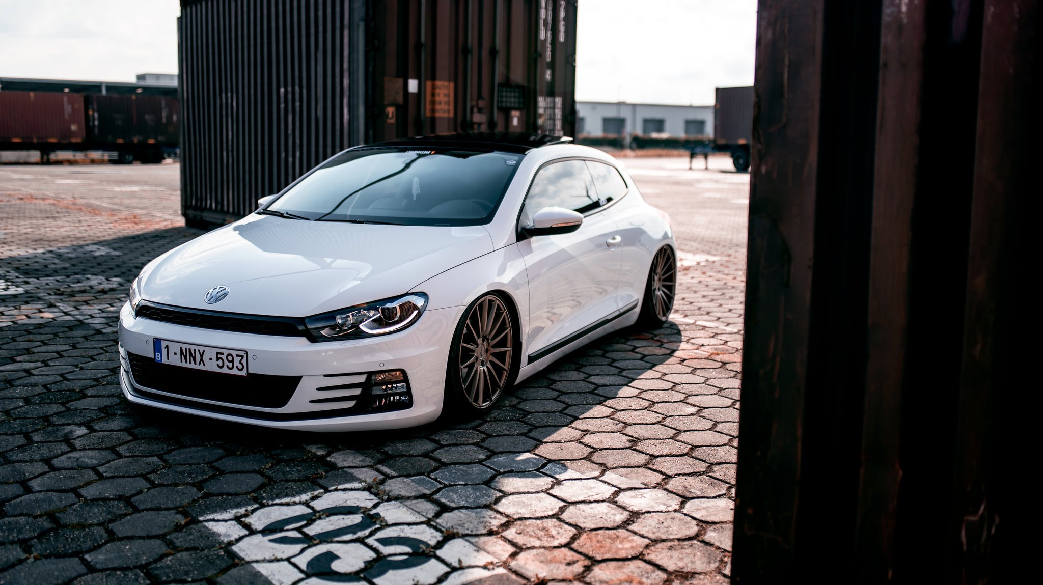 White VW Scirocco with Aftermarket Front Bumper - Photo by Niche Road Wheels