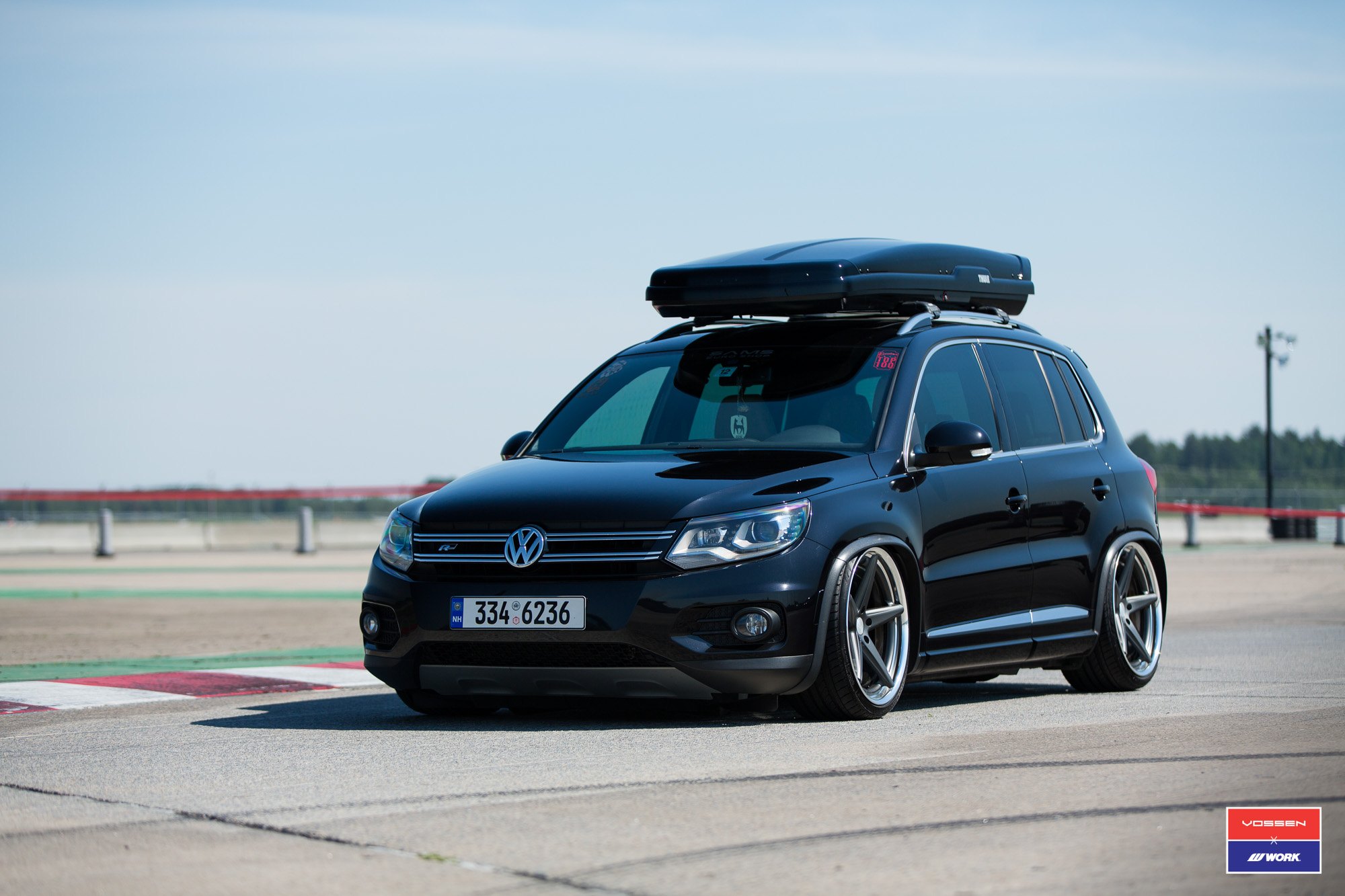 Black Volkswagen Tiguan with Thule Roof Rack - Photo by Vossen